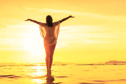 Woman,On,Holidays,At,The,Tropical,Beach,At,Sunset