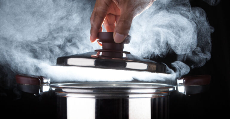 Hand,Of,Chef,Open,Hot,Stream,Pot,With,Beautiful,Studio